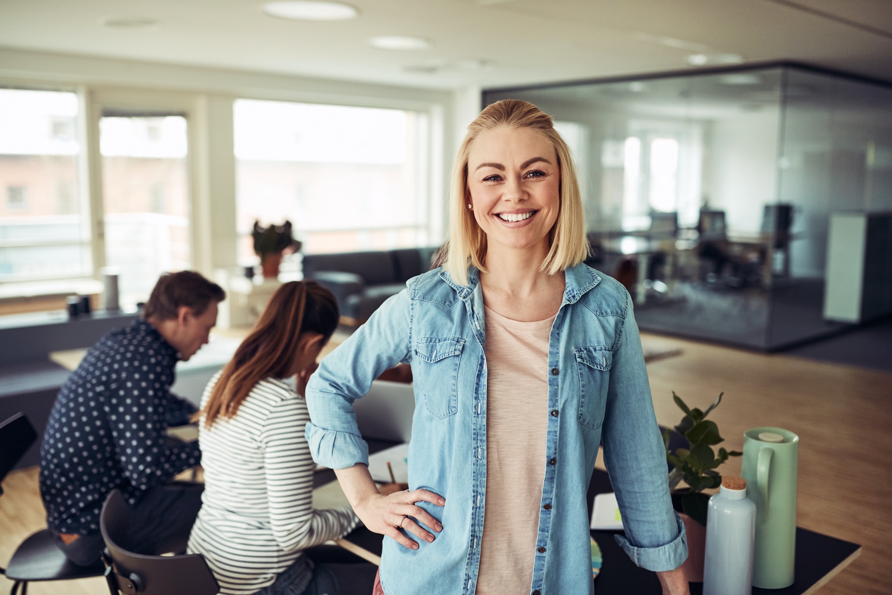 SMB Support Smiling Woman in Office SMB Suite