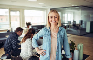 SMB-Support-Smiling-Woman-in-Office-SMB-Suite